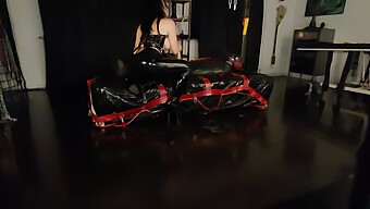 Latex-Clad Mistress Dominates With Cock In Bag